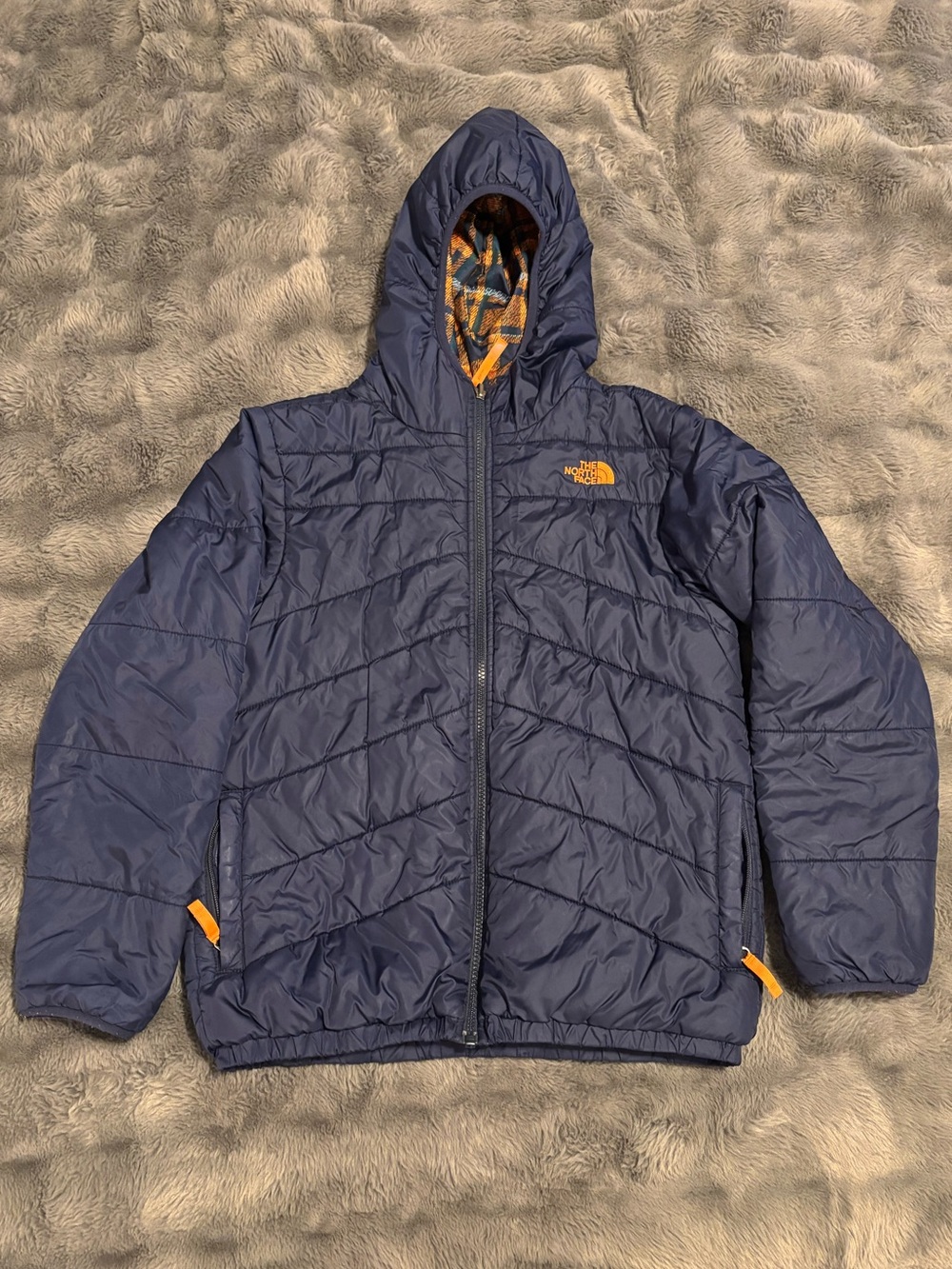 The North Face Boys reversible winter coat. Navy blue size 14/16